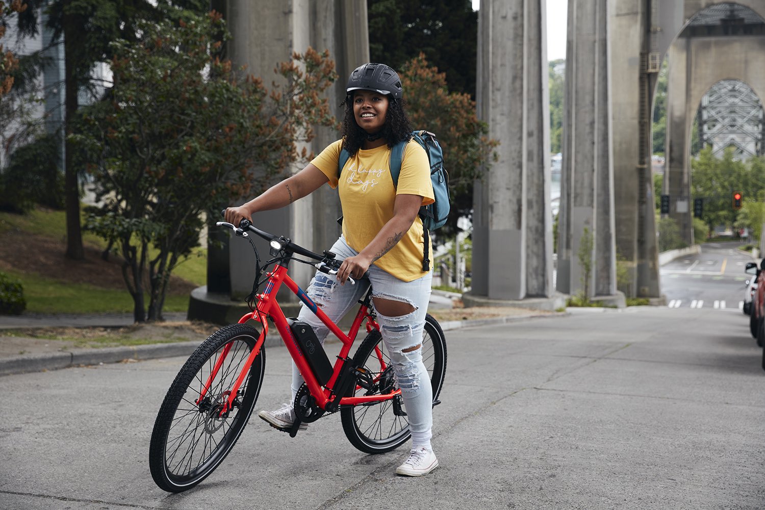 A woman rides her RadMission in Seattle.
