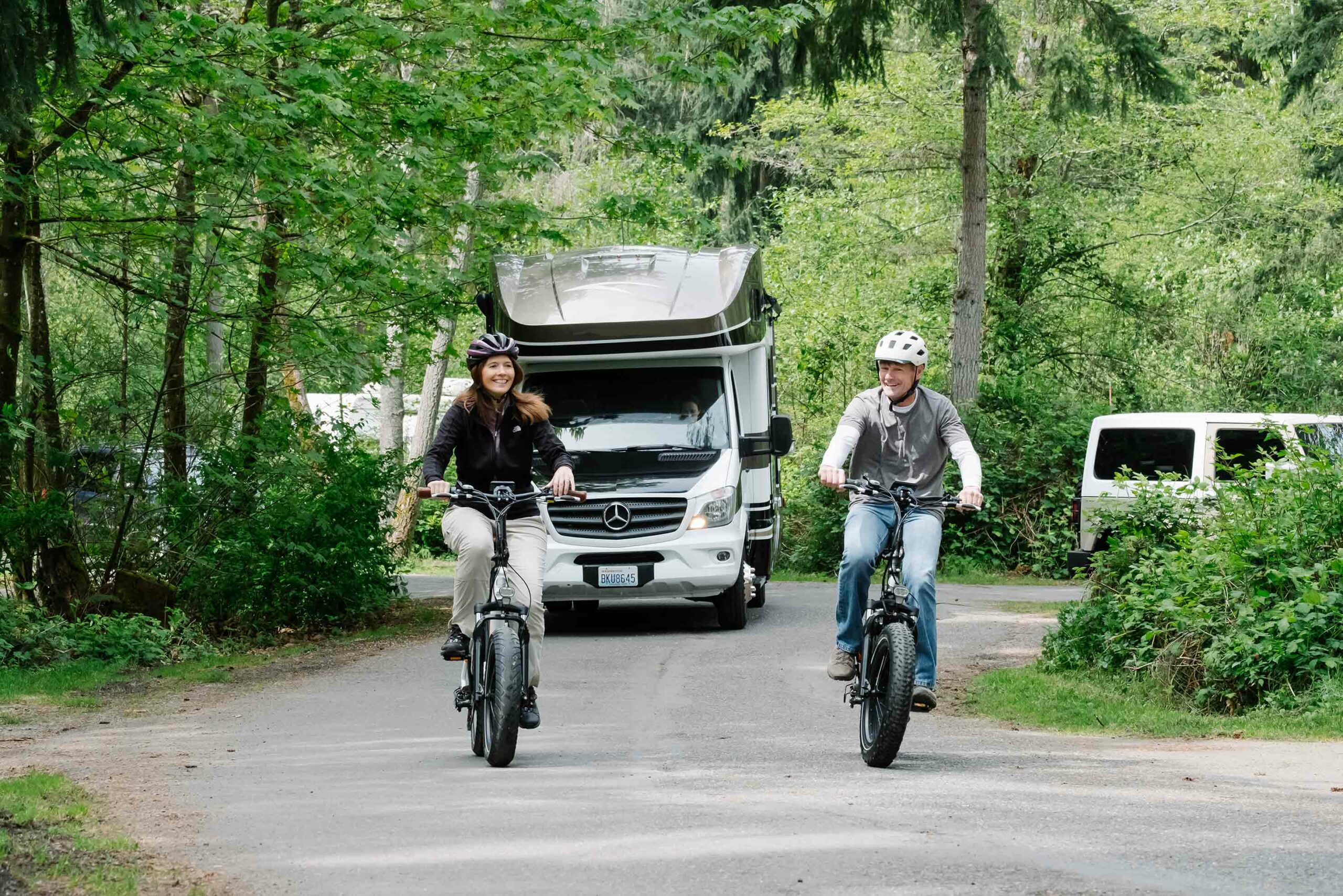 Two people load up a RadMini onto an RV.